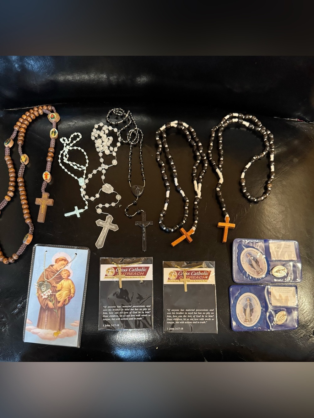 Assortment of rosaries,religious pendants and necklaces